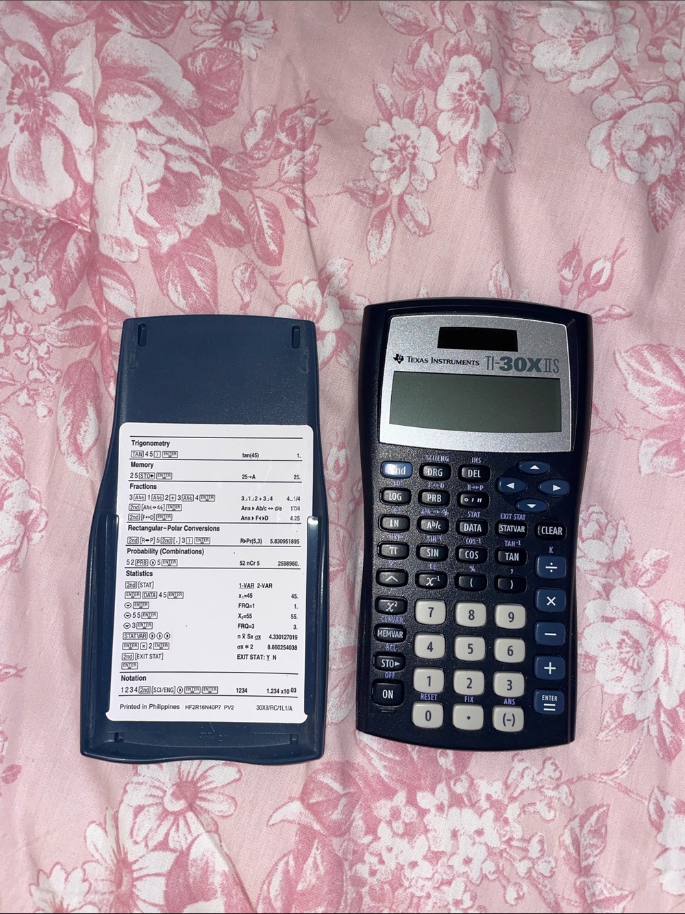 Texas Instruments navy and gray scientific calculator with cover